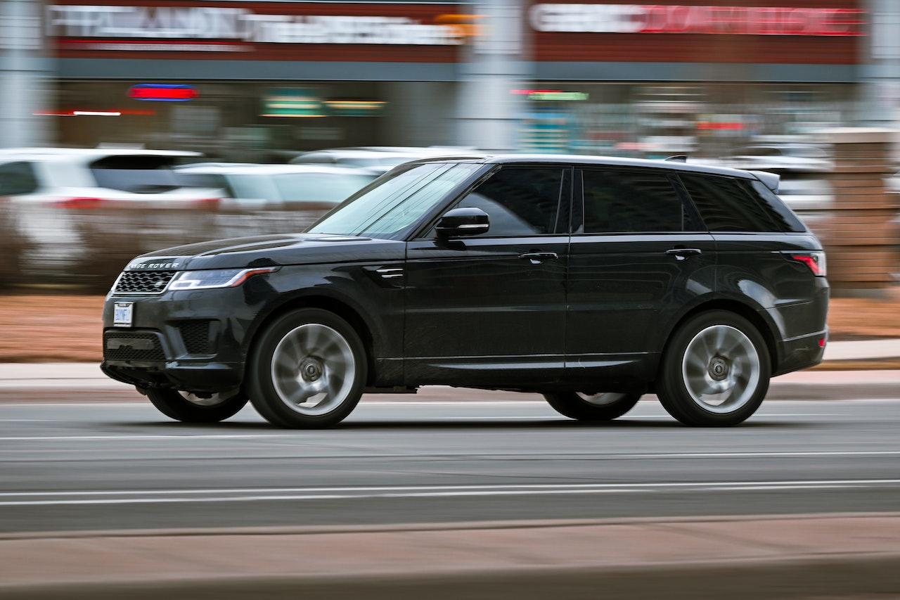 Car driving through Jersey City, NJ - Used Cars Near Jersey City concept image